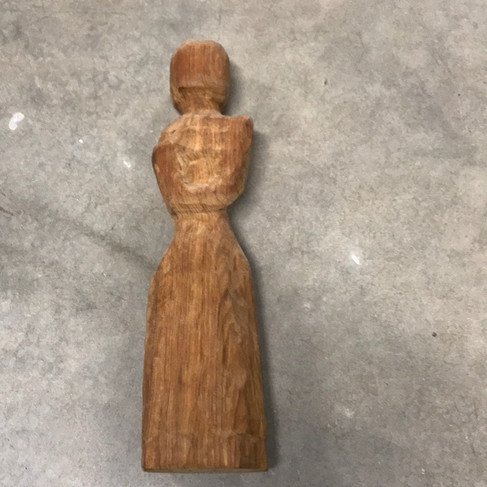 Hand carved figure out of solid wood.  12 1/2” tall.